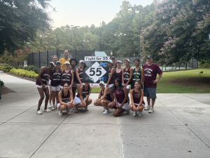 The Green Hope womens tennis team celebrates their win over Panther Creek. Photo used with permission from Coach Nathaniel Denton. 